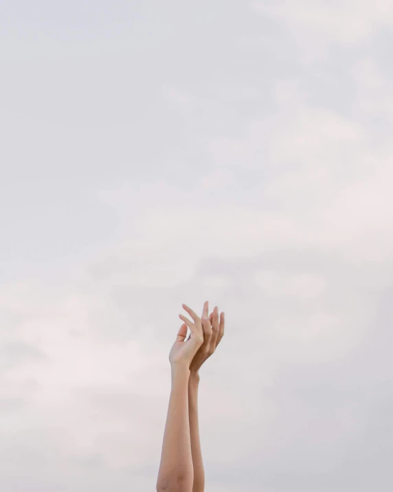 a woman flying a kite in the sky