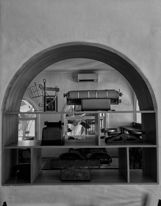 a shelf with luggage on it in a room