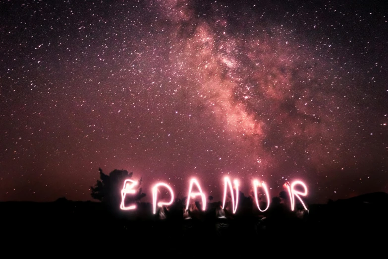 a night sky with stars and the word epanor lit up by a pair of lights