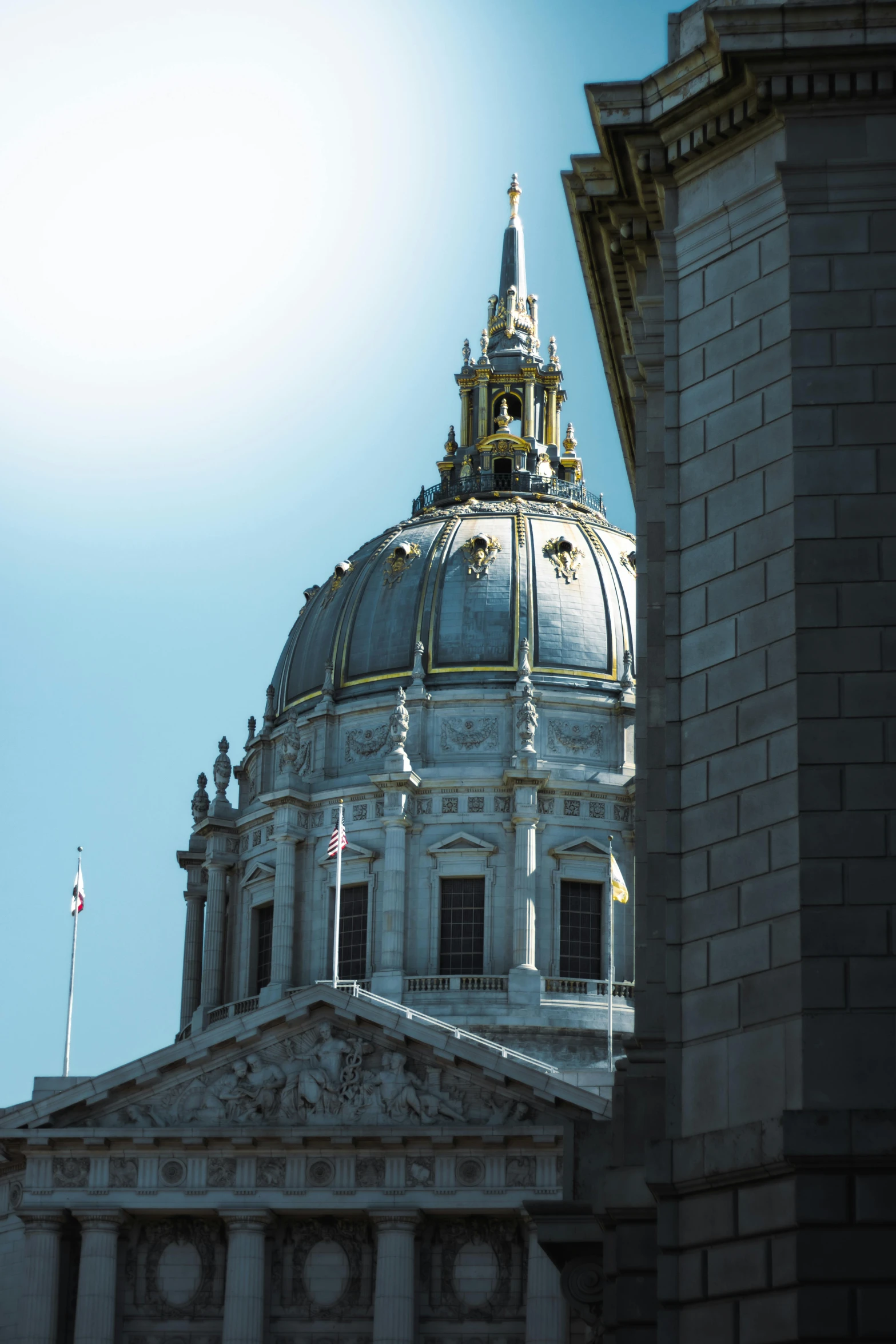 the top of the dome of a building with a clock