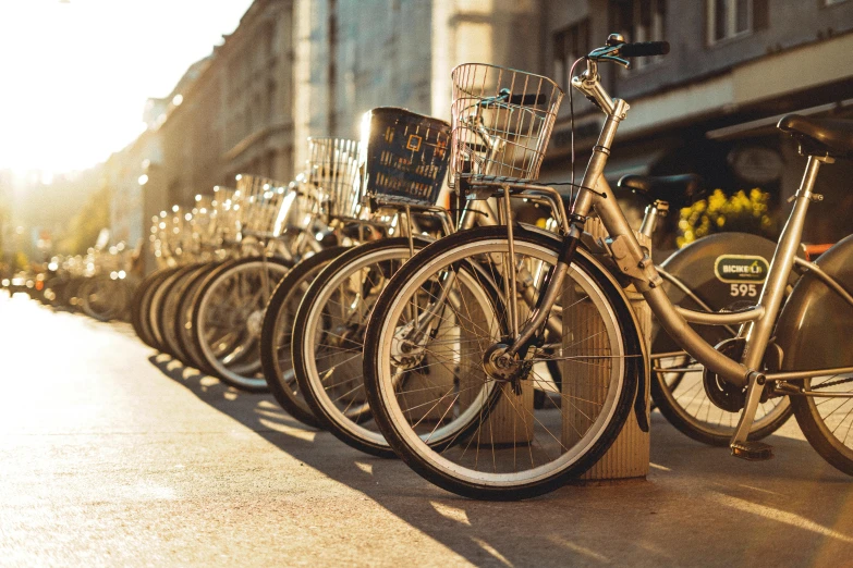 a row of bikes parked on the side of a road