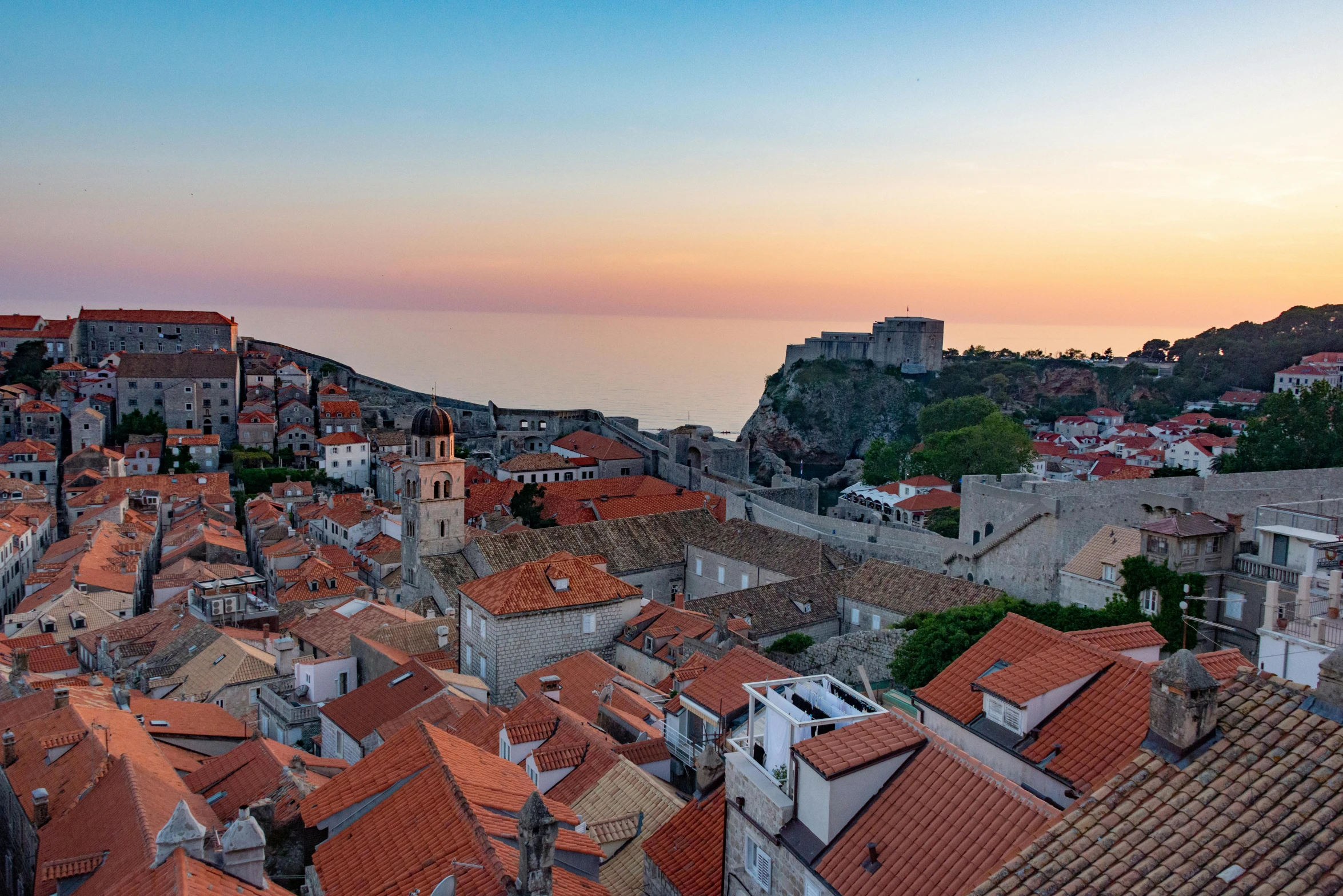 this is an image of a sunset from the roof tops