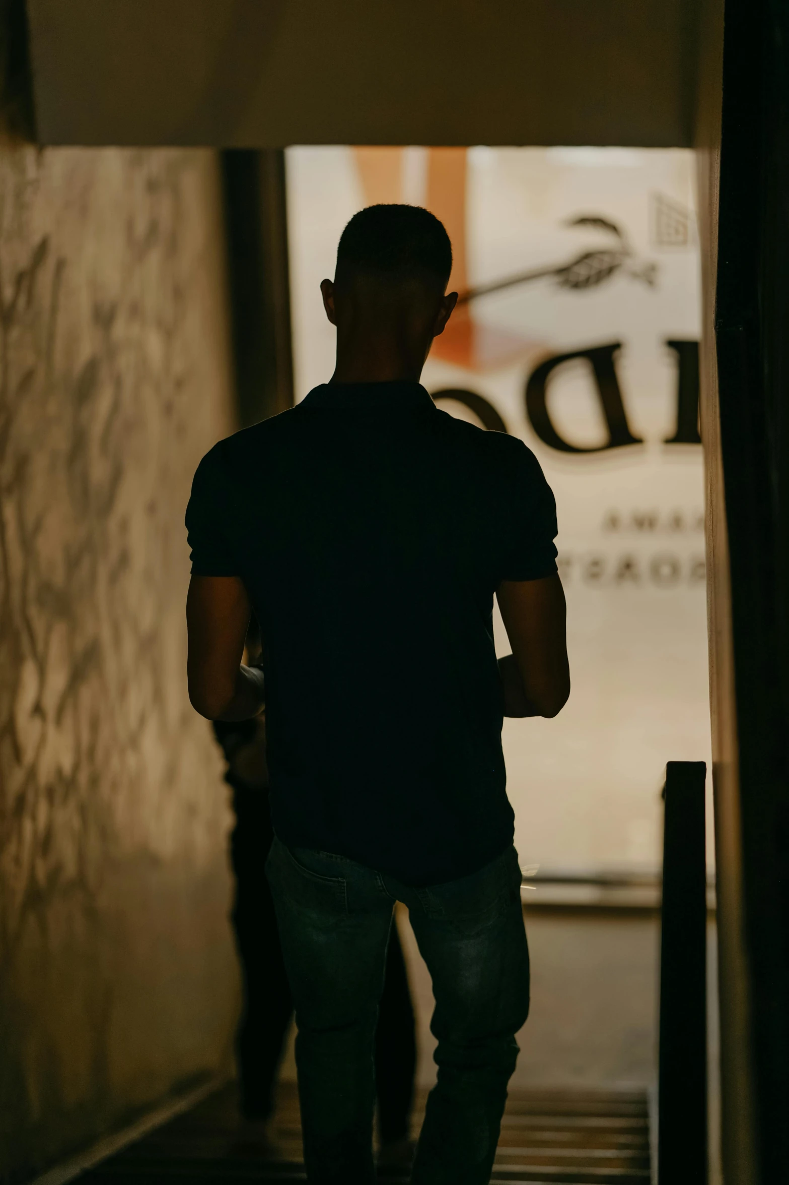 a man walks out the front of a building