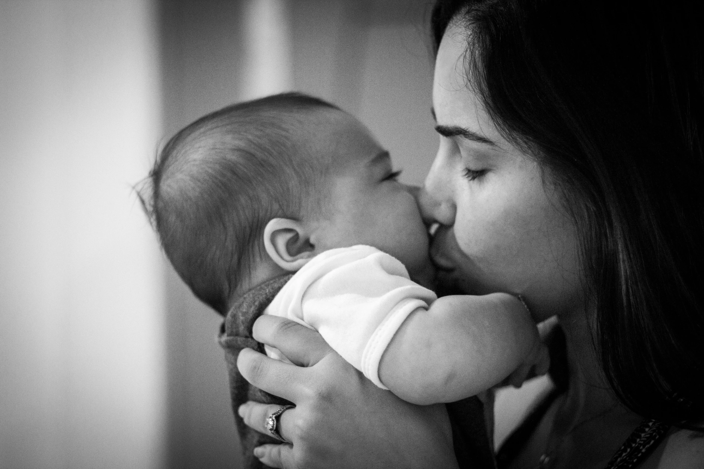 black and white pograph of a mother holding her baby