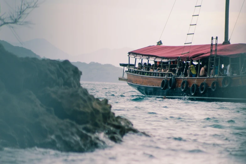 a boat in the water with some people on board