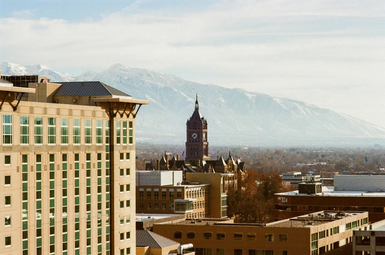 an aerial view of a mountain range with skyscrs and buildings