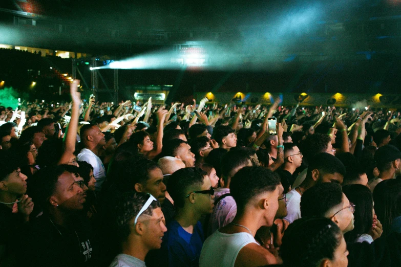 a large group of people on a stage in front of a crowd