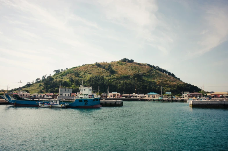 a small boat dock with boats tied to it