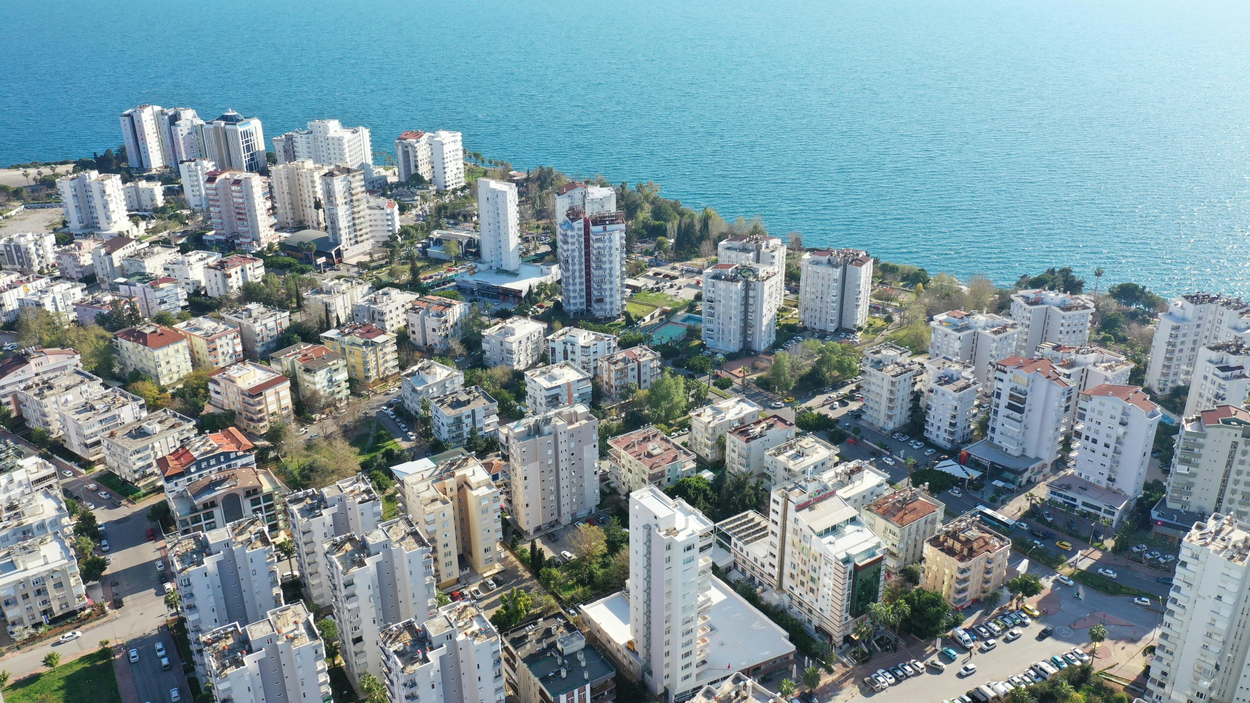 an aerial view of buildings near the ocean