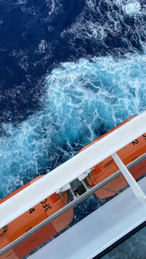 view from the top of a ship over an ocean with waves