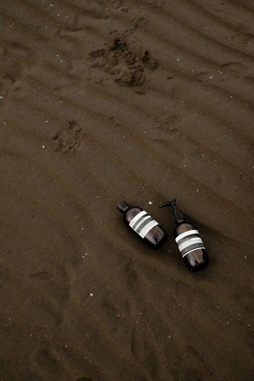 a pair of shoes laying on a beach