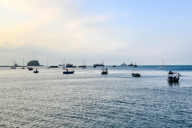 boats in the distance on the water during the day