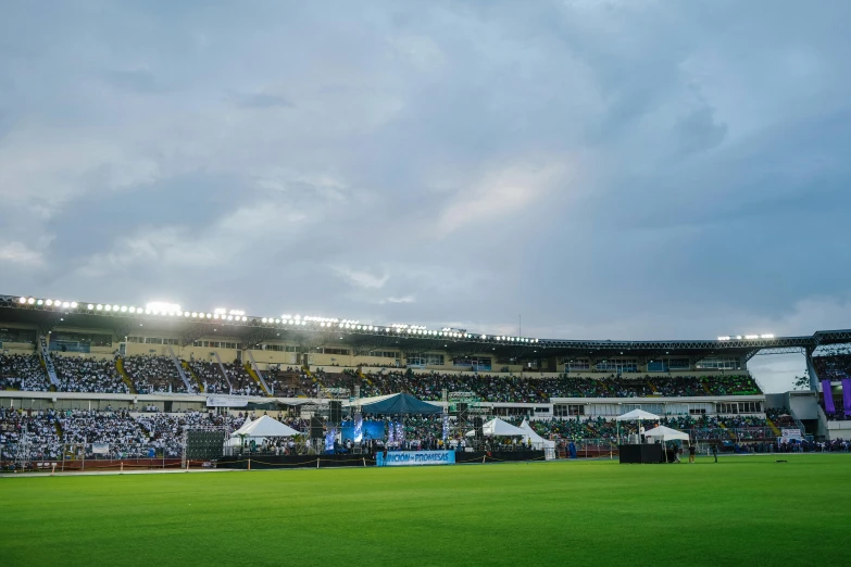 a stadium filled with lots of people and fans