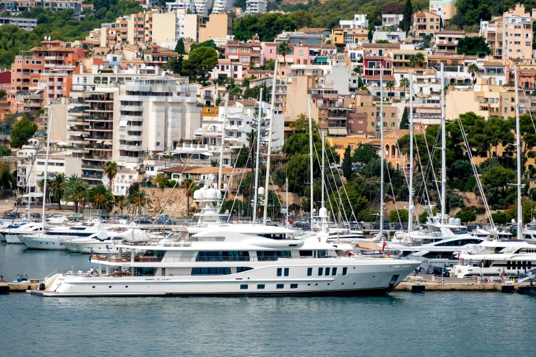 a yacht in the water near some buildings