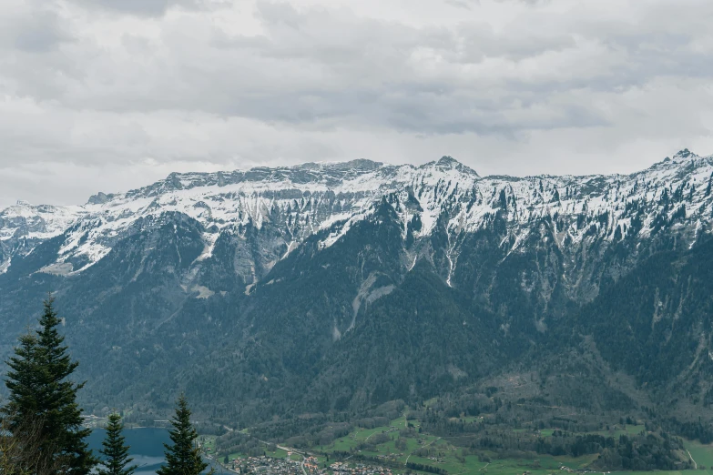 a mountain with snow on the top and mountains below