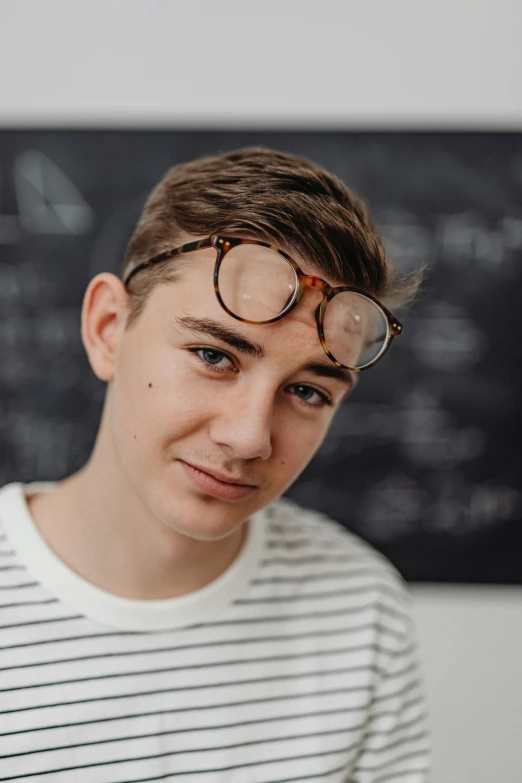 a close up of a person wearing glasses