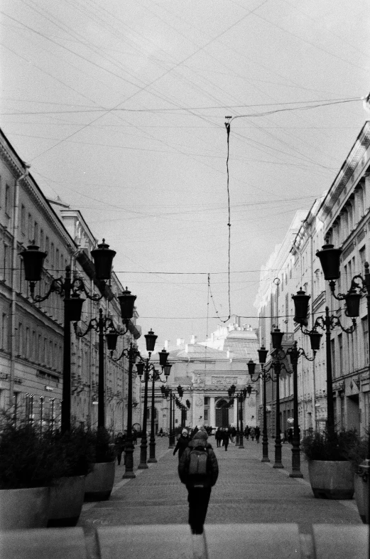 a black and white po of a person walking down the street