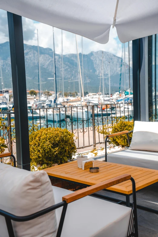 a wooden coffee table sitting on top of a hard wood patio