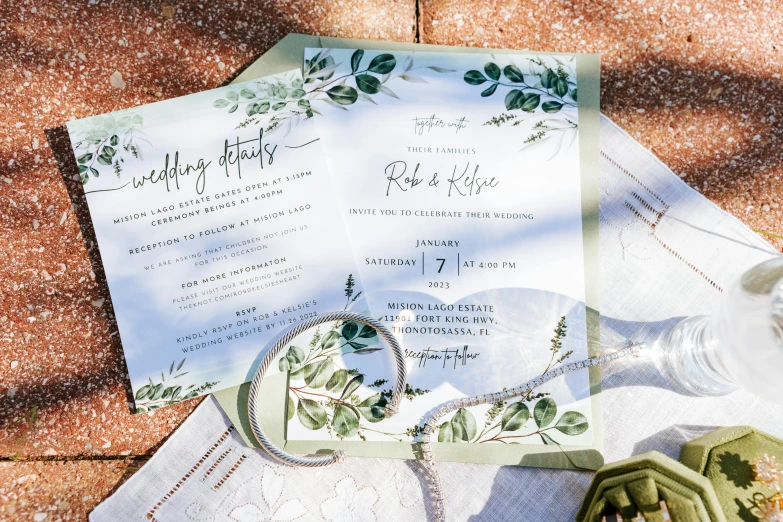 paper and ribbon folded to look like formal wedding cards