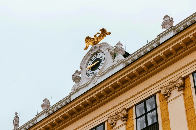 an ornate building with statues of lions and a clock tower