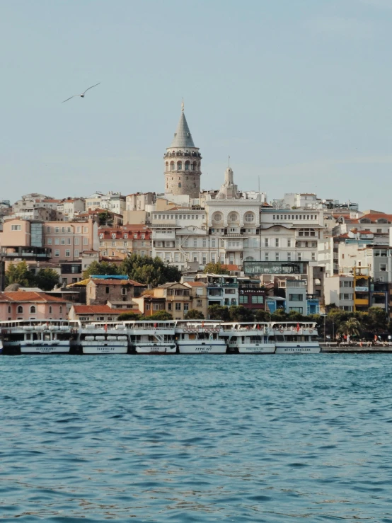 an image of boats sailing in the water in a city