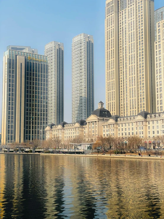 tall buildings and their reflections in the water