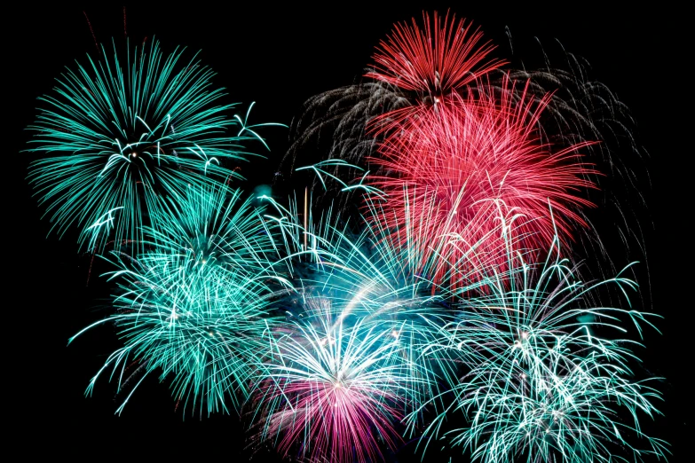 bright fireworks with many colors in the night sky