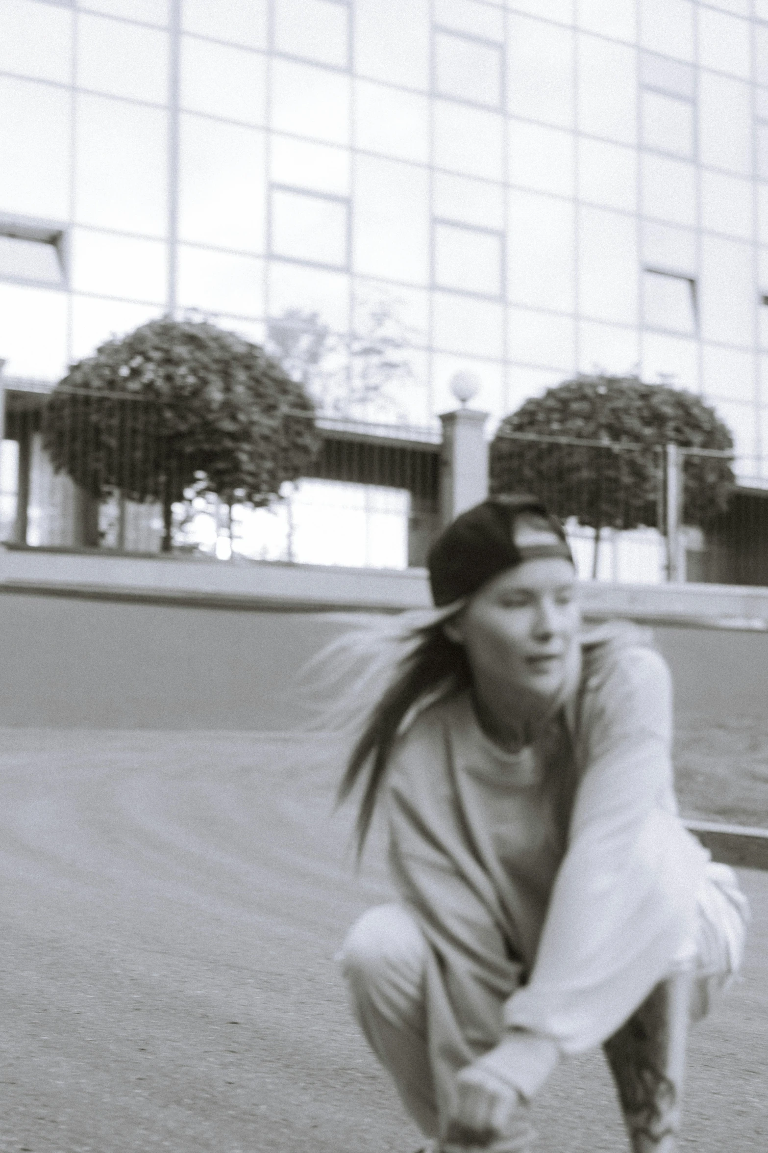 a young lady in the middle of throwing a frisbee