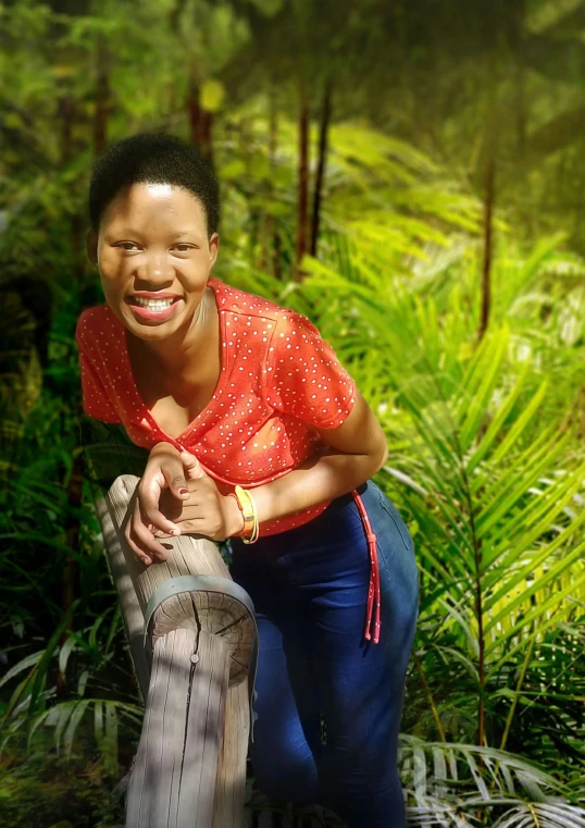 a woman kneeling in the grass on her knees