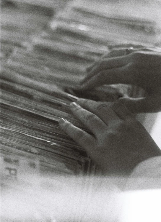 a person holding some papers in their hands