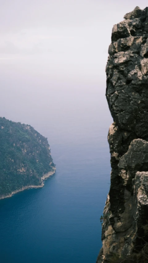 a view of the sea from a large cliff