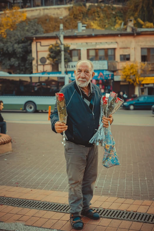 a man with three roses and a couple of candles