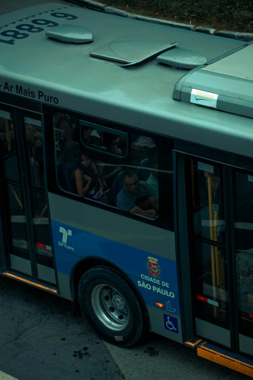 a bus with people on it and several other vehicles