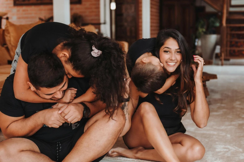 a group of people are huddled in the same pose