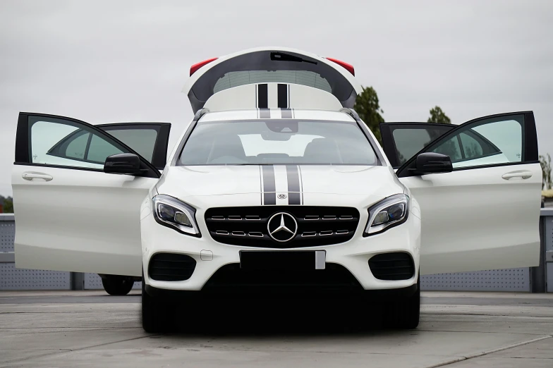 a white suv that is sitting next to another one