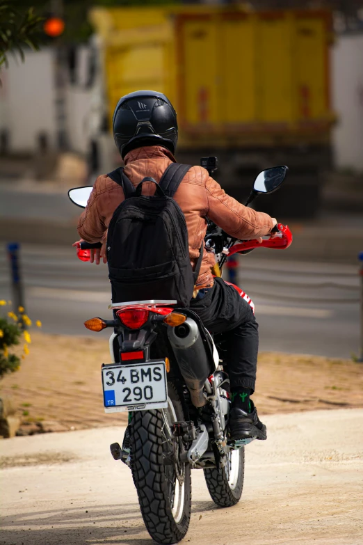 a person with muscles on their stomach riding on a motorcycle