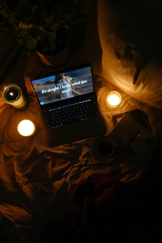 a laptop sits on a blanket, with the caption that reads, i am not alone here