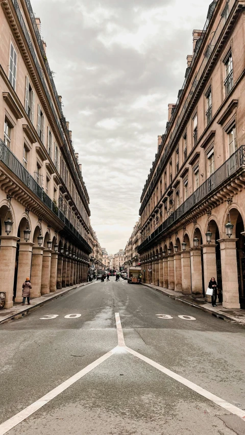 an empty, deserted street with three buildings