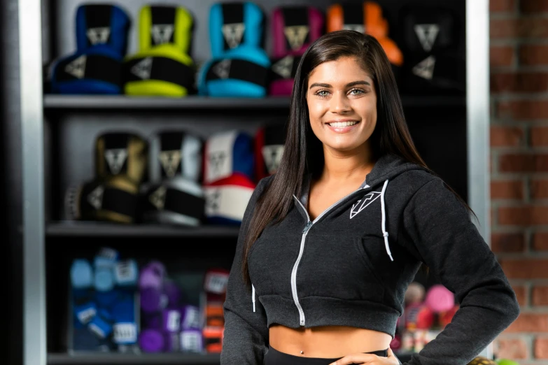 a girl wearing a black sports  posing in a store
