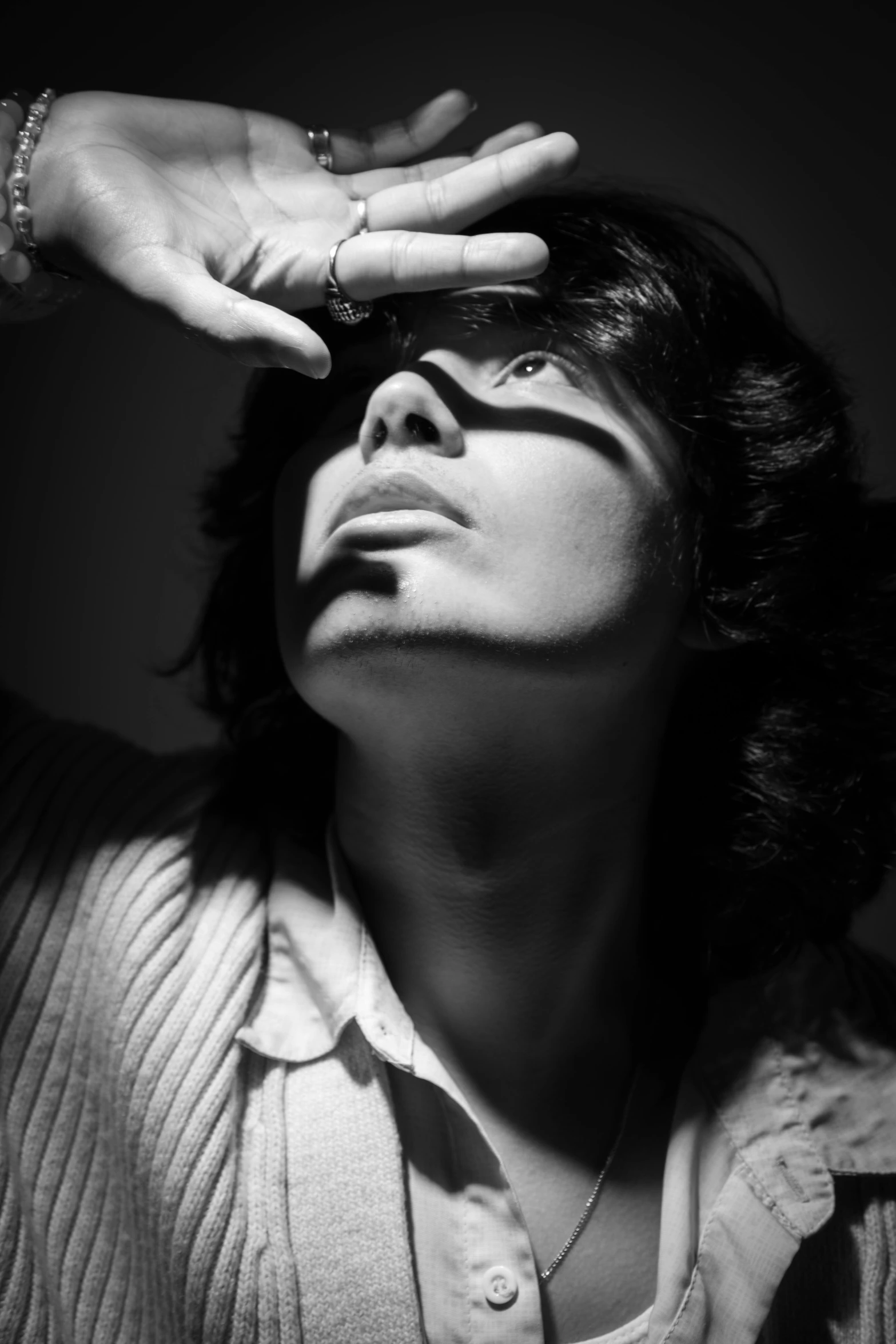 man adjusting glasses to go off by a woman's hand