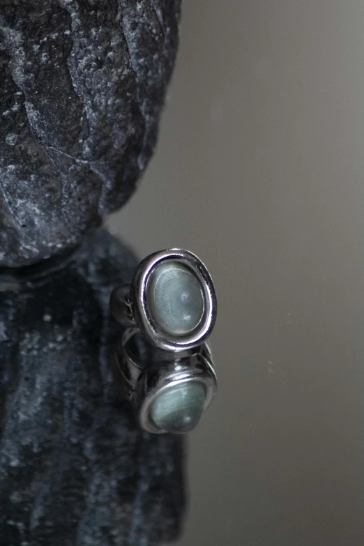 a ring that is laying on top of a rock