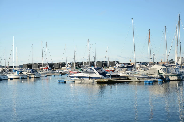 a group of sailboats sitting in the water