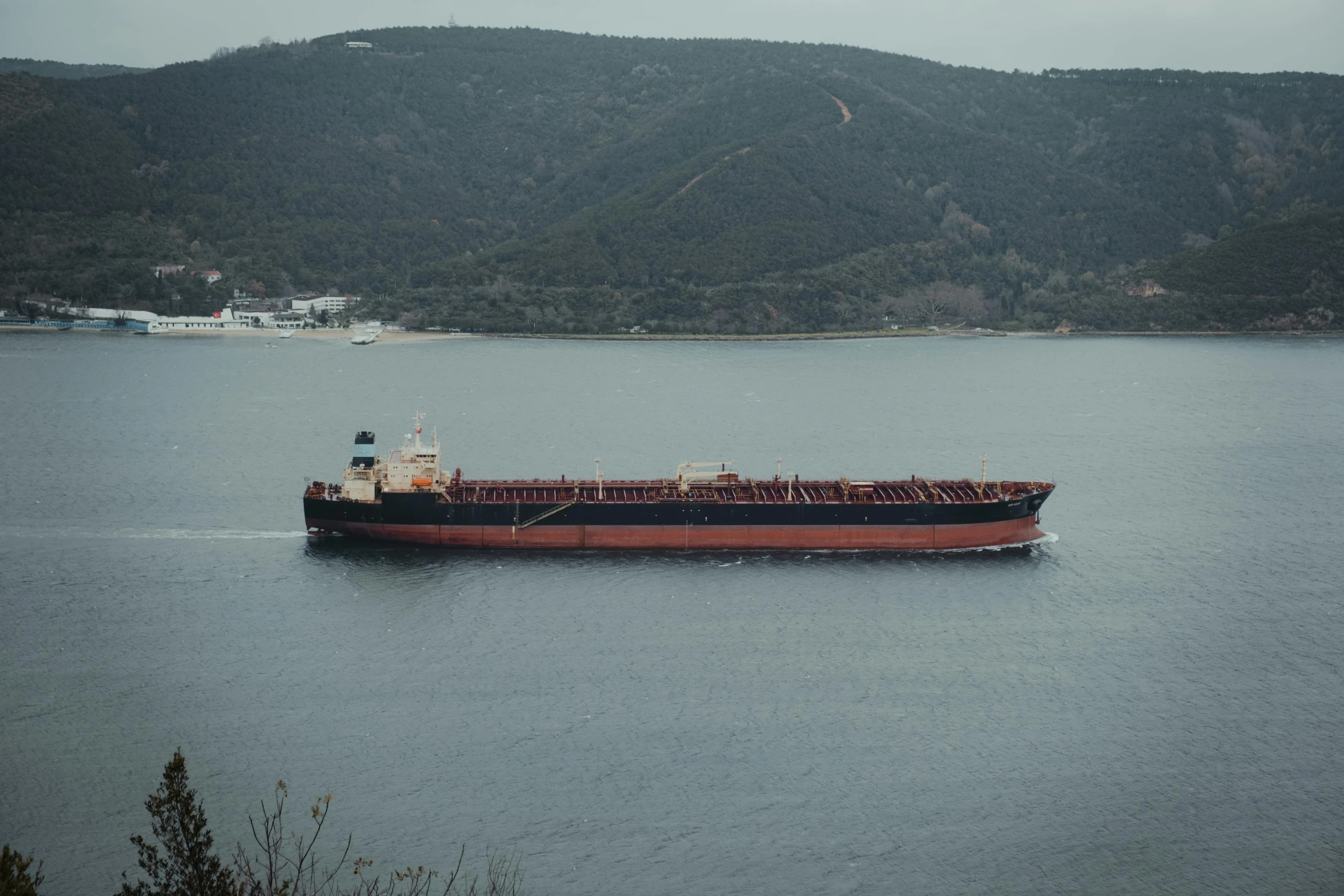 a cargo ship in the middle of a lake