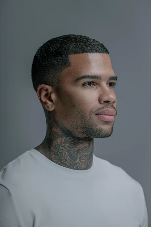 a man with a very large tattoos on his face