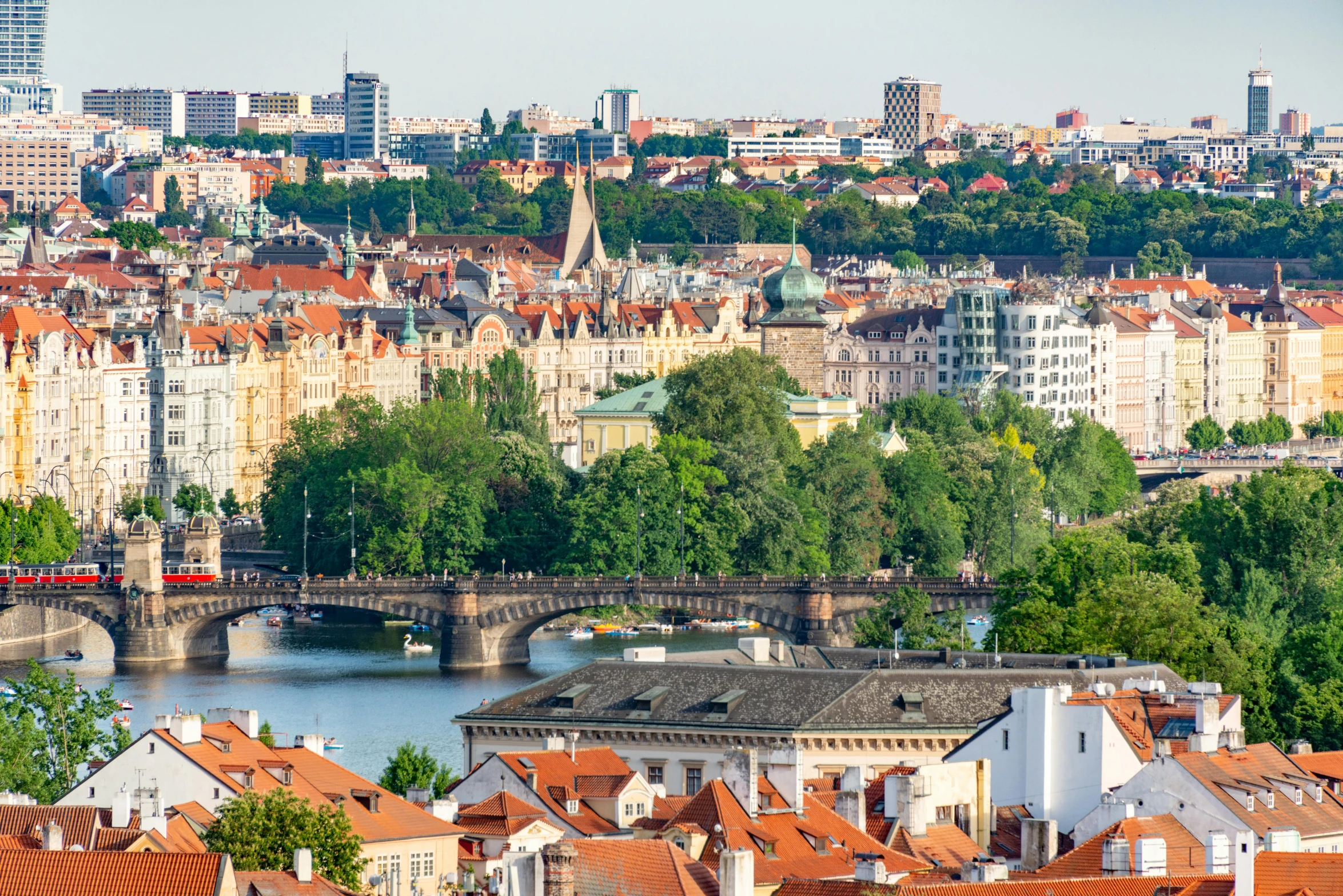 an aerial view of a city skyline from a hill