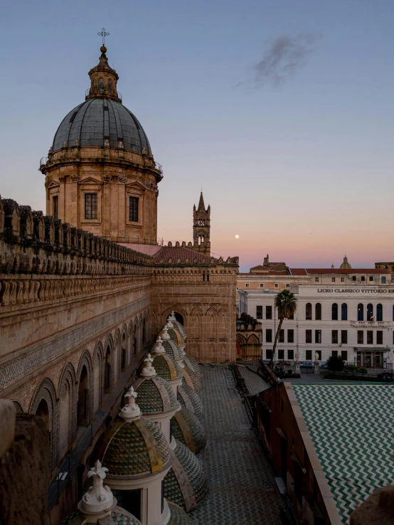 the view of an ornate building from an elevated walkway