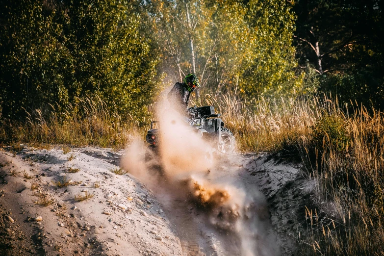 motorcycle rider in the middle of a dust trail