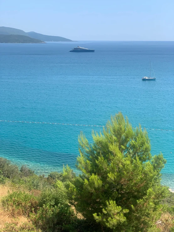 the small boat is traveling through the open ocean