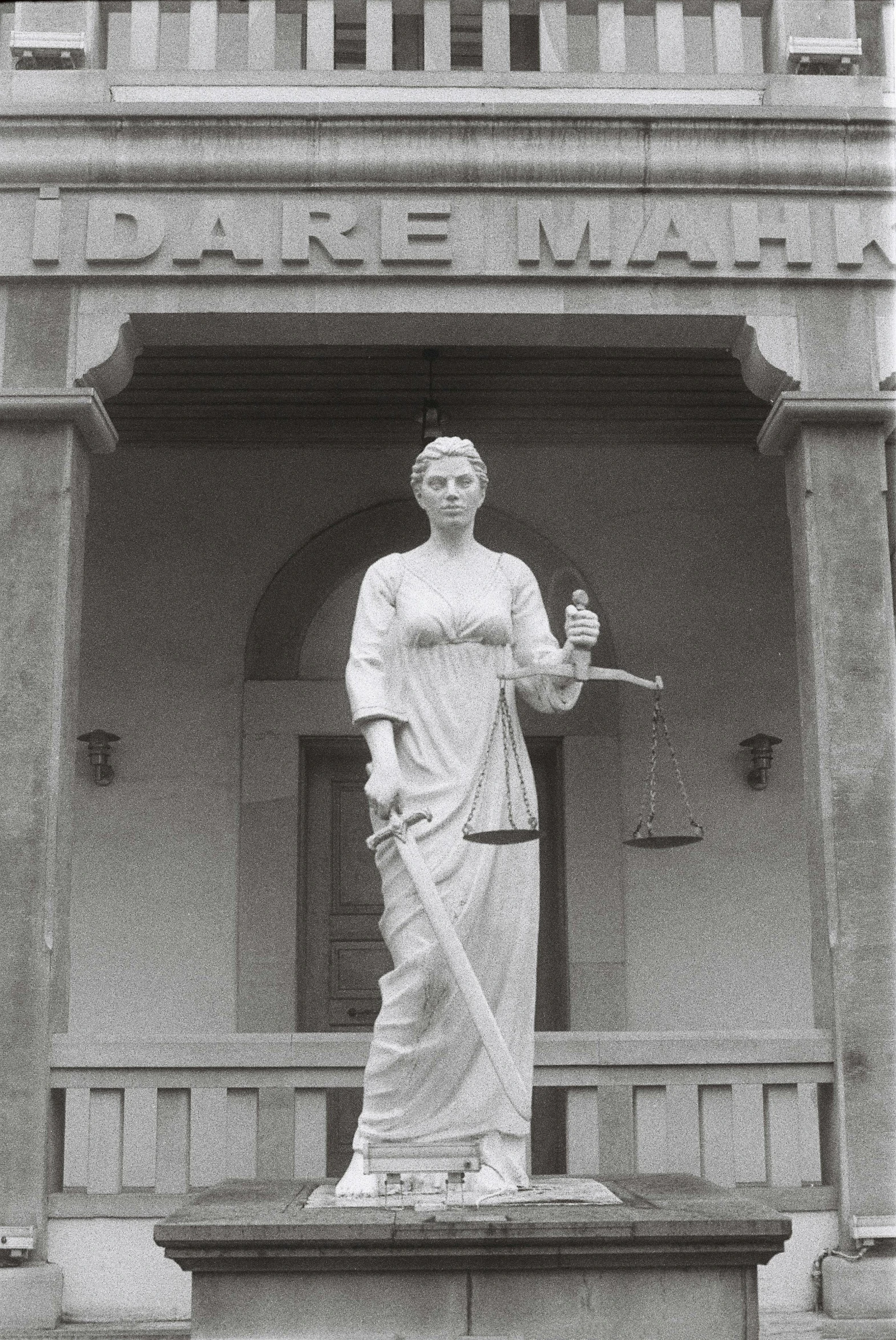 a statue is shown outside on a sunny day