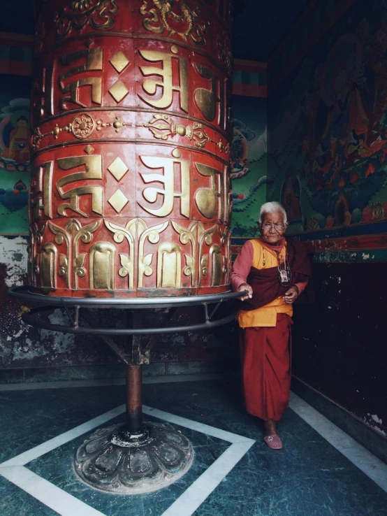 the monk is posing with his statue